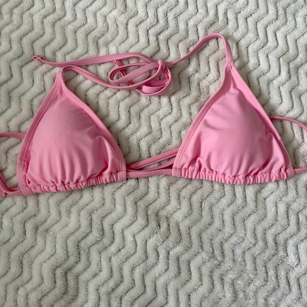this is a pink triangle bikini top in size small